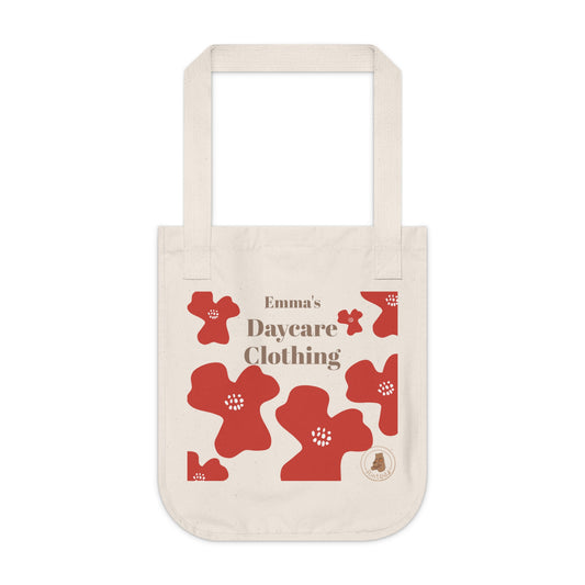 Beige tote bag with red floral designs and customisable text on a white background